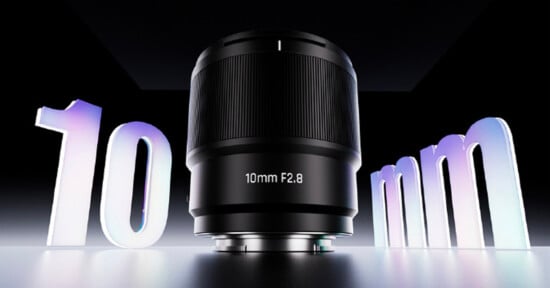 A camera lens labeled "10mm F2.8" is displayed prominently, with large, stylized "10" on the left and "mm" on the right, set against a dark, dramatic background.