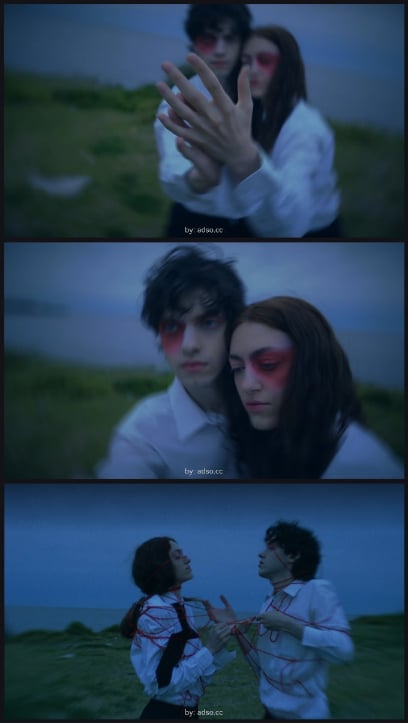 Three blurred photos show two people outdoors in dramatic makeup and white shirts. The first panel focuses on their hands, the second on their serious faces, and the third shows them tied together with red string.
