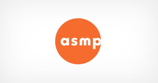 ASMP logo with lowercase white letters "asmp" inside an orange circle on a light gray background.