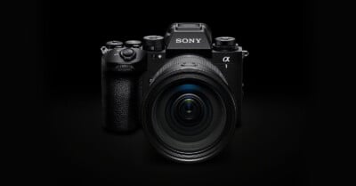 A black camera with a large lens.