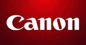 White "Canon" logo in bold, stylized font centered on a red gradient background.
