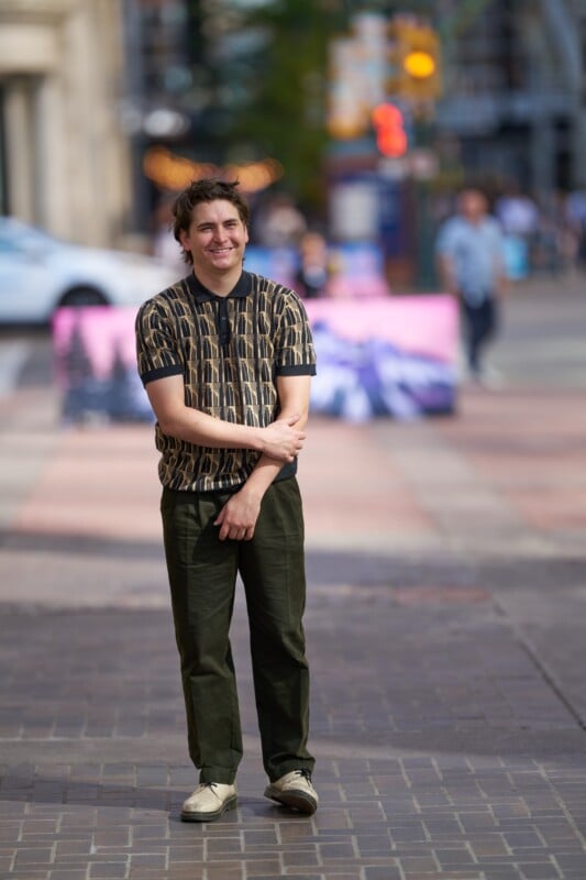 A man standing on a sidewalk.