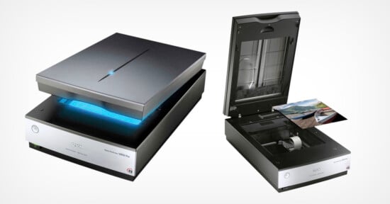 Two flatbed scanners on a white background. The left scanner is closed with a blue light underneath the lid. The right scanner is open with photographs inside. Both have a sleek, modern design.