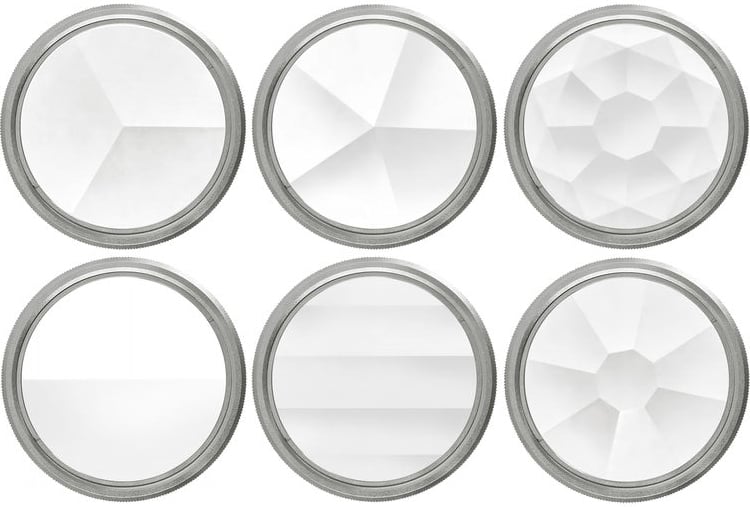 Six round glass lenses with different faceted and textured patterns, arranged in two rows of three. Each lens shows a unique geometric or prismatic surface design.