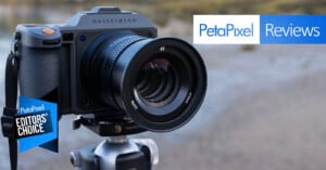A Hasselblad camera mounted on a tripod outdoors, with "PetaPixel Reviews" and "PetaPixel Editors' Choice" banners overlaid on the image.