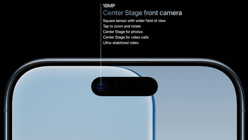 Close-up of a smartphone’s front camera with a display highlighting its features: 18MP sensor, Center Stage for video and photos, wider field of view, tap to zoom and rotate, and ultra-stabilized video.