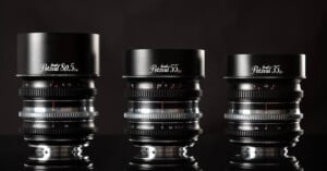 Three Petzval camera lenses are displayed side by side against a black background, labeled 80.5mm, 55mm, and 35mm from left to right, with reflective bases and metallic detailing.