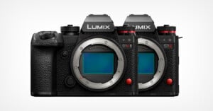 Two Panasonic Lumix S1R mirrorless cameras are shown side by side, facing forward, without lenses attached, displaying their image sensors and textured black bodies.