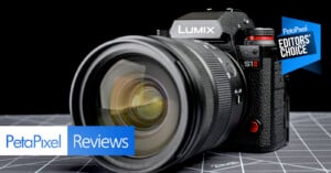 A close-up of a Panasonic Lumix S1 II camera on a grid-patterned surface, with "PetaPixel Reviews" and "Editors' Choice" labels overlaid on the image.