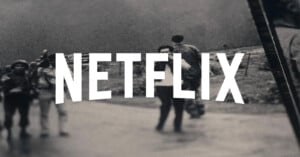 The word "NETFLIX" in bold white letters is superimposed over a blurred black-and-white photo of people walking outdoors.