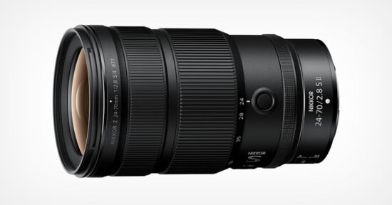 A Nikon NIKKOR Z 24-70mm f/2.8 S II camera lens is shown on a white background, displaying its zoom and focus rings, lens markings, and branding on the barrel.