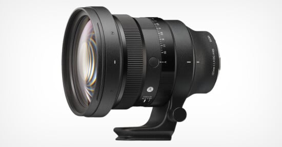 A large black Sigma camera lens with a wide front element, focus and aperture rings, adjustment markings, and a lens mount foot, displayed on a white background.