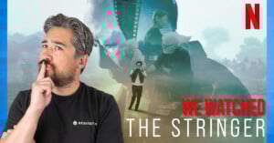 A man with gray hair and a beard looks thoughtful with a finger on his lips. Behind him are images of serious people and a photographer, with the Netflix logo and the title "We Watched The Stringer" displayed.